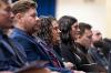 Graduates listening as Aaron Grabovich, Program Director of Anesthesiologist Assistant Program, address to them.