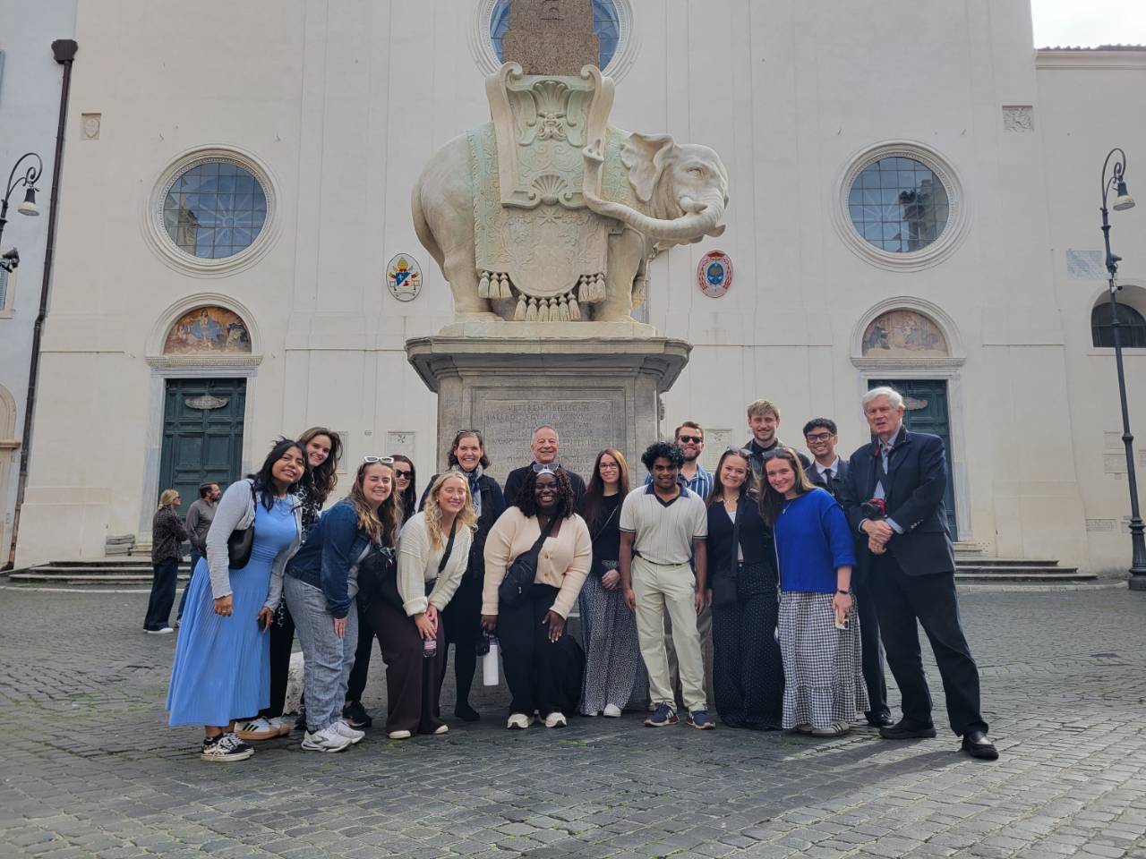 Ohio Dominican University students pose in front of a historic landmark while studying abroad in Italy.