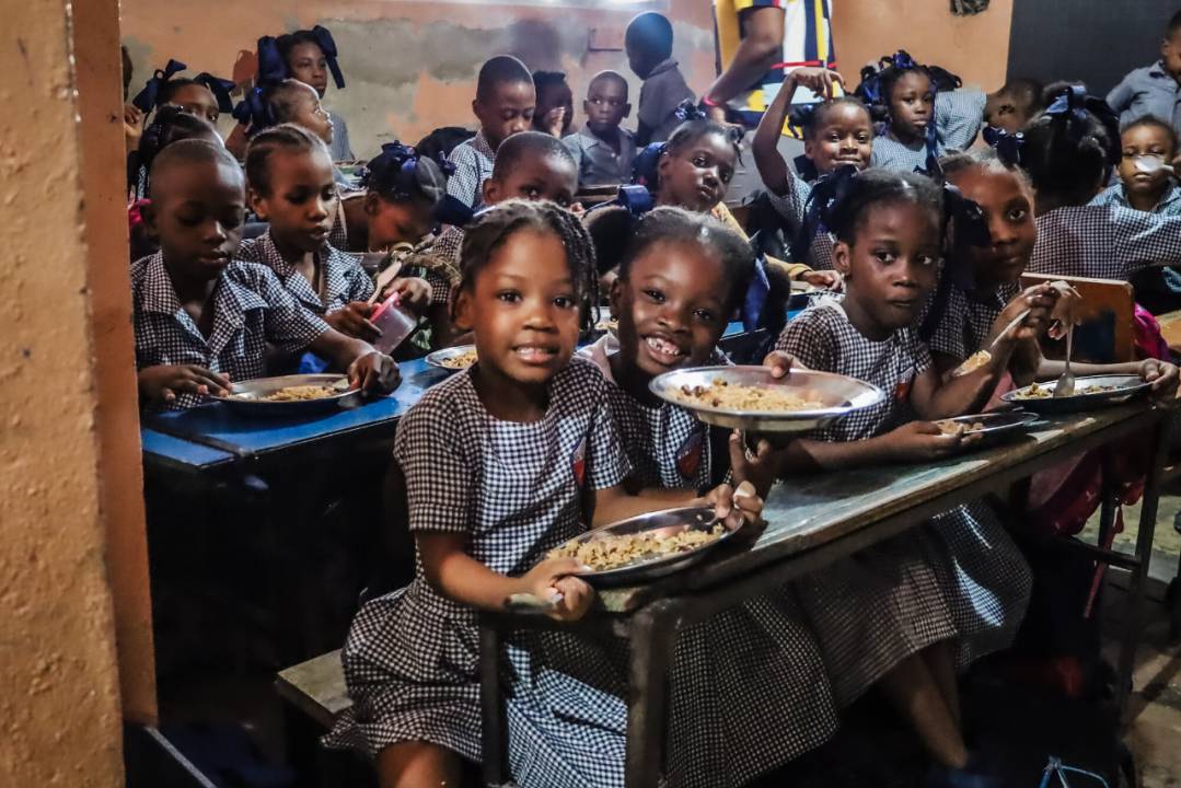 Children eating Mary's Meals at Verena II School (Maïs Gâté) in Haiti