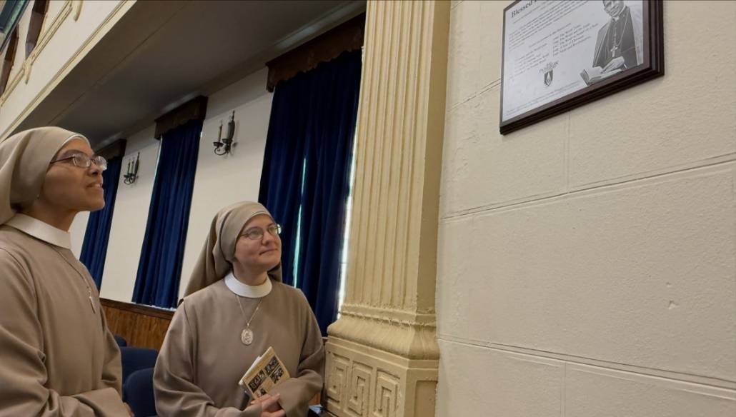 A commemorative plaque honoring Blessed Fulton J. Sheen is displayed in Matesich Theatre.